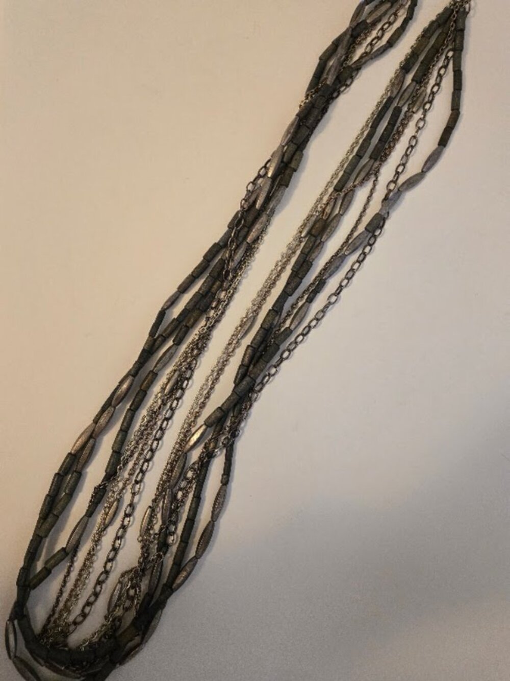 Chico's long multi-strand necklace in gray metallic tones